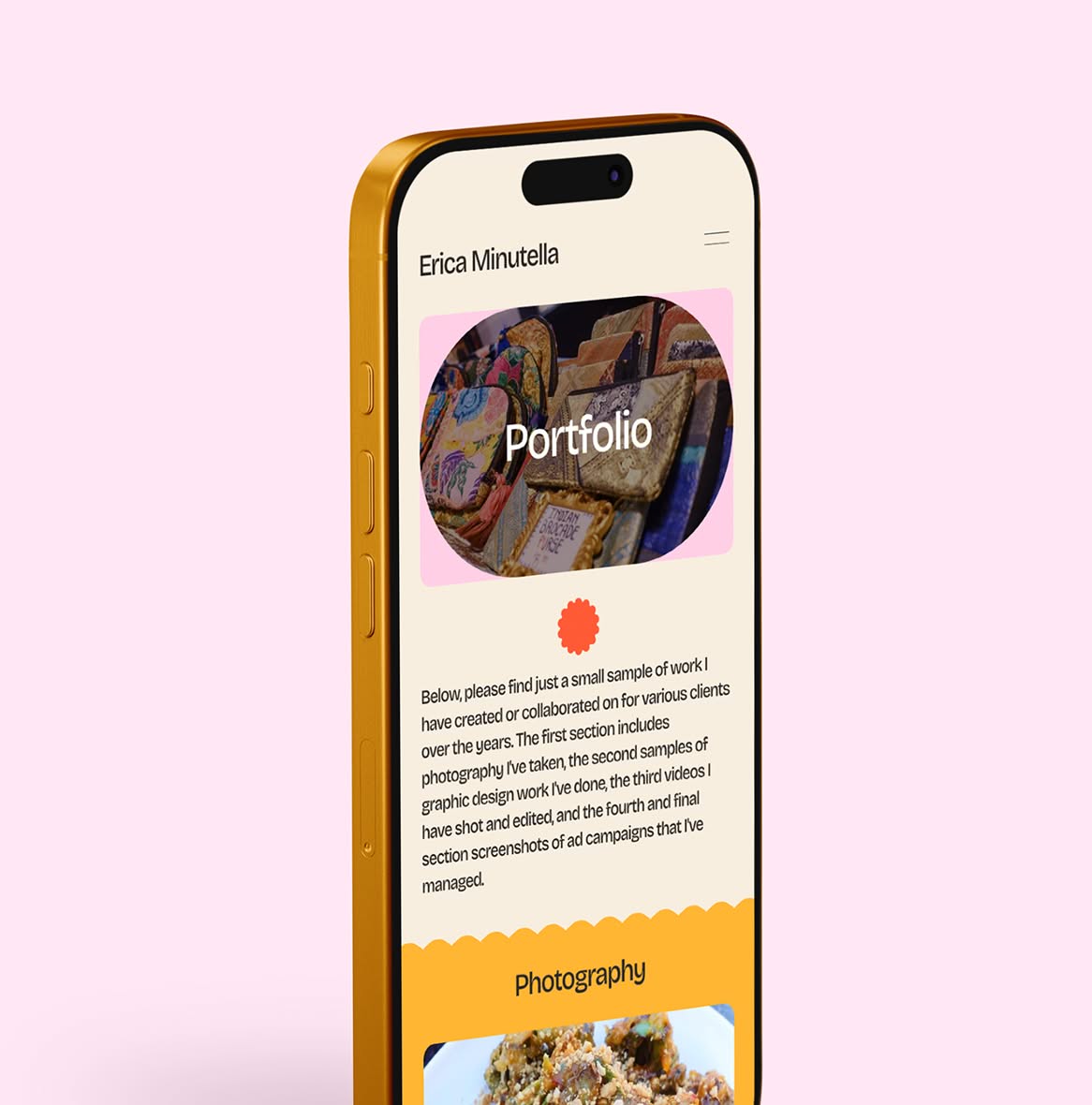 EricaMinutella-PortfolioMobile A gold smartphone displaying a portfolio webpage titled "Erica Minutella" on a light pink background. The page features colorful embroidery images.