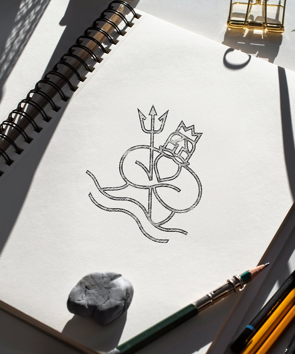 NeptuneMarket-Sketch A sketchbook page shows a stylized drawing of Neptune holding a trident. The page is lit warmly, with shadows. Nearby are pencils and an eraser.