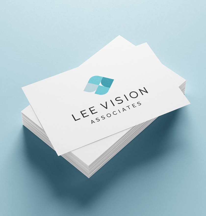 LeeVision-BusinessCards A stack of business cards with the logo and text "Lee Vision Associates" in black on a white background. The logo is abstract in shades of blue.