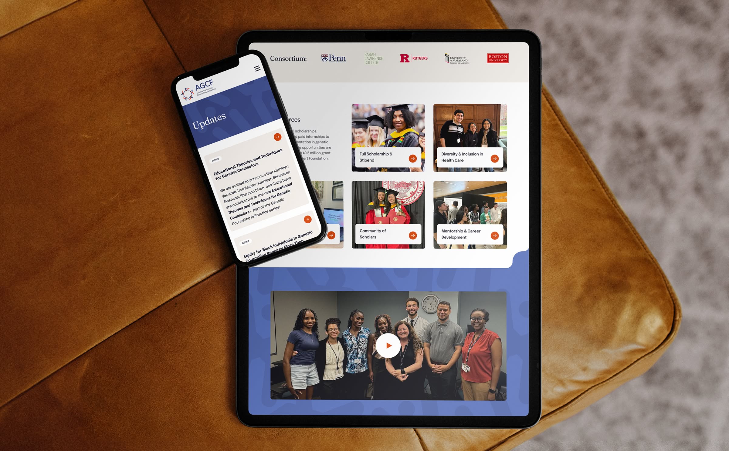 Tablet and smartphone sit on a brown leather chair displaying sections from the AGCF website. The tablet shows various images and text related to educational content and community activities, while the phone shows an updates section.
