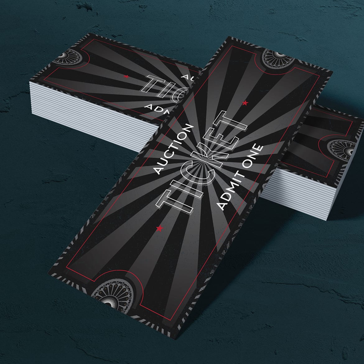BIBK-Tickets A stack of black auction tickets with a thin red border and a sunburst pattern. Bold, white text reads "Auction Ticket Admit One."